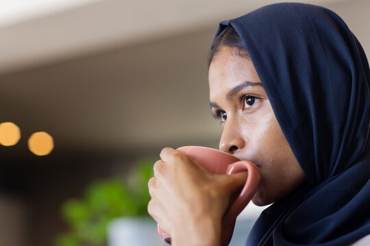 Teacher and student discussing series convergence in tutorial, teacher writing on board with chalk