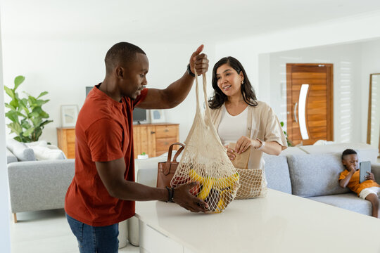 Male developer coding Newton solver with line-search at desk using vector x solving Laplacian q(x)