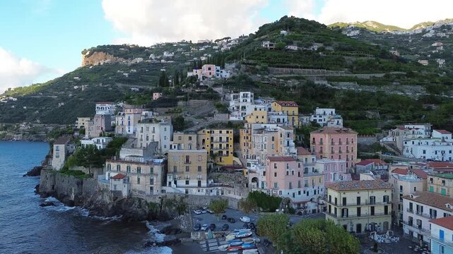 Minori old town and summer beach with umbrellas , Italy