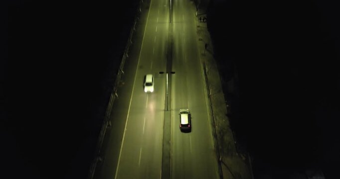 Suspicious traficking car drive on illuminated street at night