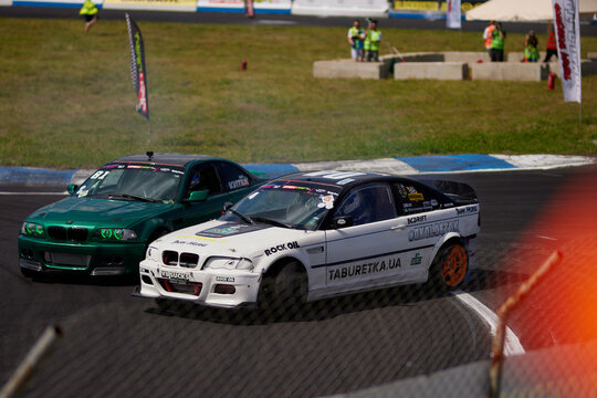 Kyiv, Ukraine, Chaika Raceway - August 3, 2023: Drift car in a race with smoke. Drift car close-up. Drift cars and drivers, street racing, auto culture. Drift culture.