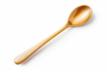 Golden spoon lying on a white background, representing luxury and kitchenware aesthetics