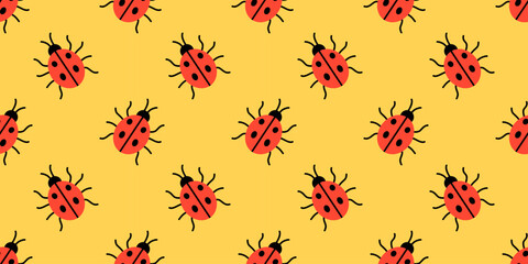 Vector seamless pattern with cute red ladybug on yellow background. Playful spring insect print for kids fabric, nursery wallpaper, wrapping paper, stationery and cheerful nature decor. © Ulyana Mo