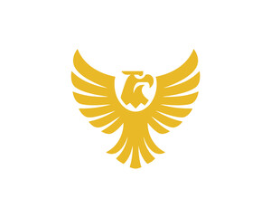 Obraz premium Golden eagle emblem with outstretched wings and detailed feather pattern.