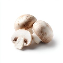 Two champignon mushrooms one whole and one cut in half, isolated on white background with clipping path