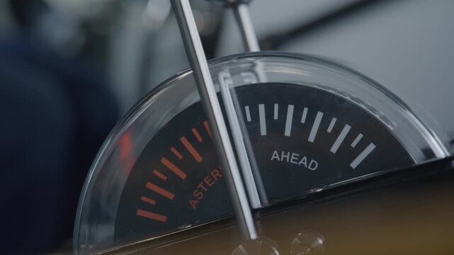 Navigating a large oceanfaring ship steering wheel and speed gauge