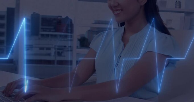 Woman placing hands on keyboard and typing, ECG waveform pulsing across hands for health monitoring