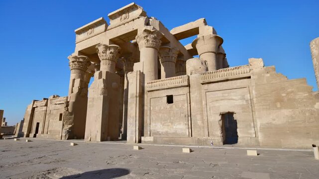 Kom Ombo temple ruins with double columns and composite capitals against clear blue sky in Egypt