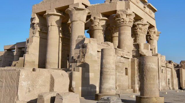 Kom Ombo temple ruins with double columns and composite capitals against clear blue sky in Egypt