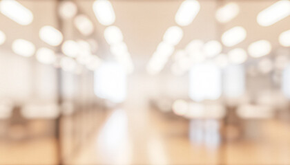 Fototapeta premium Blurred view of a modern office interior featuring large windows, wooden flooring, and sleek furniture. Natural light fills the space creating a bright ambiance.