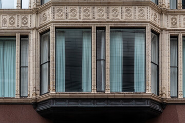 Rectangular window with an alcove, decorated with carved beige tiles. From the Windows of the World series. © dotsent