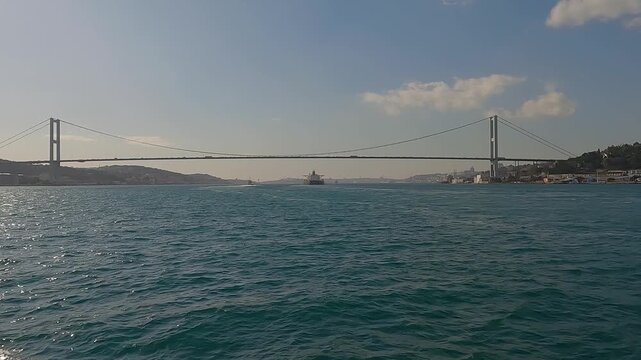Istanbul strait. Super Tanker Ship Cruising Along Bosporus. Tanker ship pass through the bosporus with bosphorus bridge in istanbul turkey. Concept of sea freight transport. 