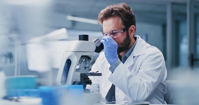 Man, scientist and microscope with vials in laboratory for forensic science or medical research. Male person, biologist or inspection with biotechnology for clinic trial, test results or findings