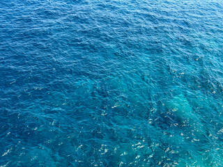 Obraz premium Ocean blue waves calm surface background.