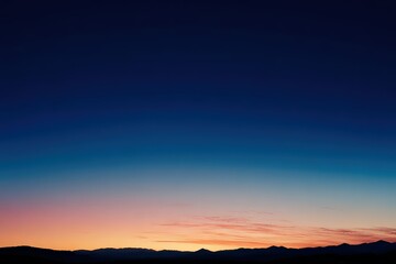 Fototapeta premium Dramatic Gradient Sky with Dark Blue to Orange Horizon Silhouette of City Buildings Against Twilight Sky Vibrant Color and Peaceful Atmosphere at Dusk