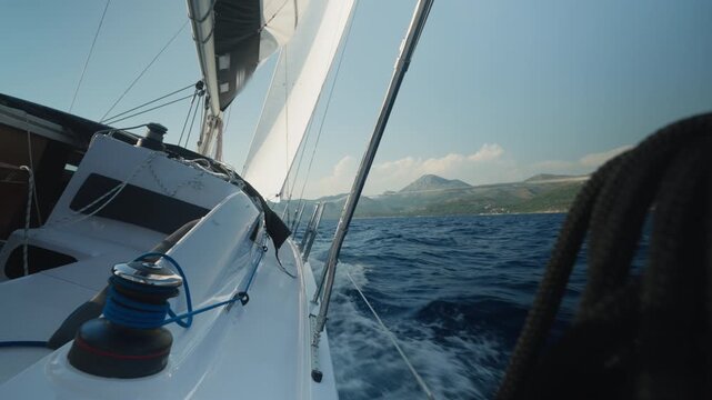 Boat Moves Swiftly Through Turbulent Waters. Sailing Vessel Accelerates Through Tumultuous Waves As Crew Skillfully Manages Sails And Steering Mechanisms