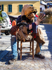 Naklejka premium Schignano Carnival, a traditional and historic event that represents the ugly and the beautiful.