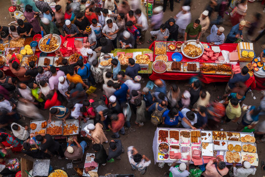 Dhaka, Bangladesh - 03 March 2026: Aerial view of Iftar Market teeming with vibrant stalls and bustling crowds, a symphony of colors and textures under the watchful eye of a drone..