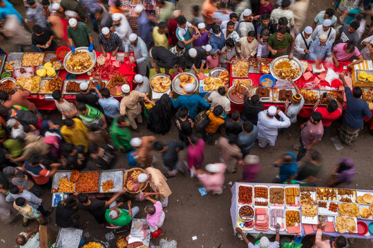 Dhaka, Bangladesh - 03 March 2026: Aerial view of Iftar Market's bustling stalls, where vibrant colors and aromatic spices mingle amidst a sea of eager shoppers.