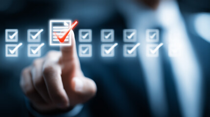 Fototapeta premium Finger selecting checklist item symbolizing compliance verification and quality assurance. 