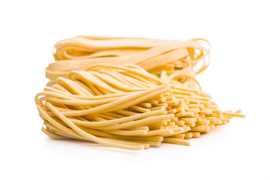 Fresh pasta ready for cooking, showing strands of bigoli set on a white background