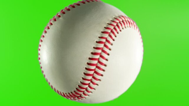 Rotating White Baseball Ball on Green Screen Background . Filmed on High Speed Cinematic Camera at 1000 fps