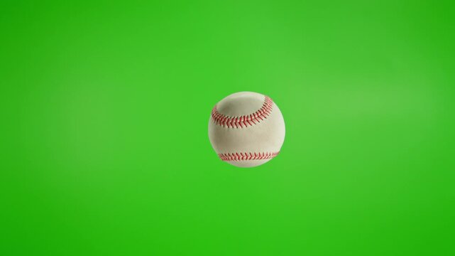 Rotating White Baseball Ball on Green Screen Background . Filmed on High Speed Cinematic Camera at 1000 fps