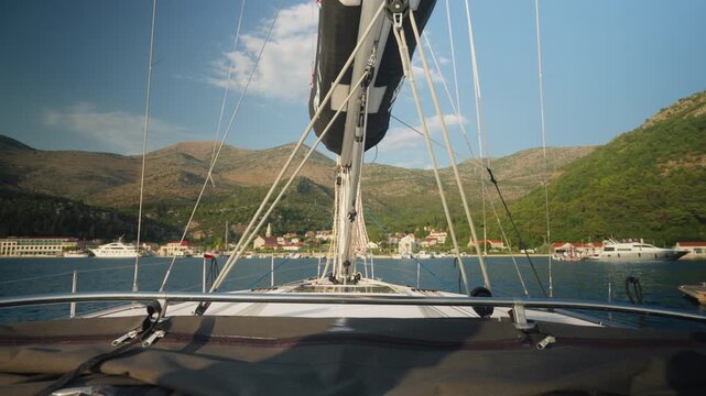 Serene Marina With Boats And Hills. Tranquil Harbor View With Masts And Coastal Village. Peaceful Waterfront Panorama Showing Anchored Vessels And Sunlit Hillsides