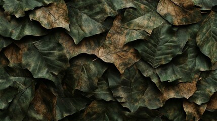 Pile of dry green and brown leaves with textured surface in natural pattern