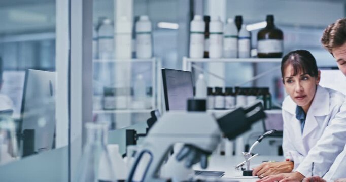 People, team and scientist with computer at lab, talk or point for review with medical research. Man, women and group with feedback, checklist and pc with pharmaceutical study for vaccine development