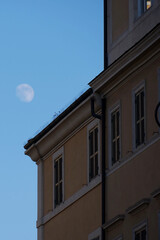 Fototapeta premium Moon over a historic building. 