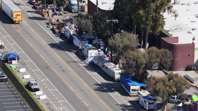 Aerial view of homeless people living in RV motorhome and tents on the streets of Los Angeles due to high rent, poverty and failed economy.