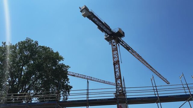 Cologne, Germany - Jul 20, 2023: Nnew building construction site with cranes in downtown of Cologne, Germany. Industry and real estate concept