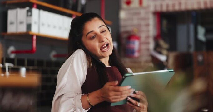 Woman, talk and phone call in restaurant with tablet, check inventory online and order stock for diner. Manager, person and discussion in small business with tech, contact and hospitality logistics.