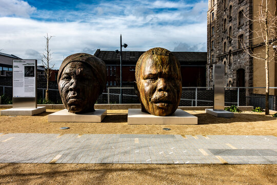 Large bronze head sculptures of Harriet Tubman and Marcus Garvey by Tavares Strachan at Boland's Mills, Grand Canal Dock, Dublin, Ireland.