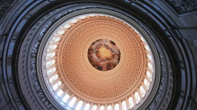 The mesmerizing dome inside of US Capitol in Washington, DC. Capitol's cast-iron dome is among the oldest such structures in the world