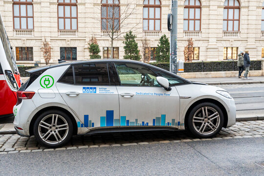 Vienna, Austria- Feb 21, 2026: A modern vehicle featuring a KONE advertisement rests on a city street, showcasing urban transport solutions and mobility innovation in a bustling environment.