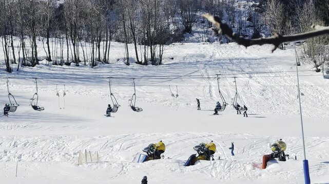 Italy, Limone Piemonte, February 26, 2026. 
Skiers Riding Chairlift at Snowy Mountain Resort
Djundiet A.