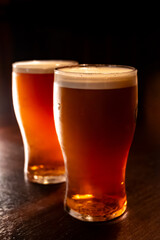 Classic London pub crawl with friends, enjoying cask ales and lively atmosphere of traditional British pubs, grasses of cask ales beer from barrels