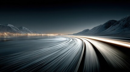 Obraz premium Long exposure showing car trails on road with coastal mountains at night