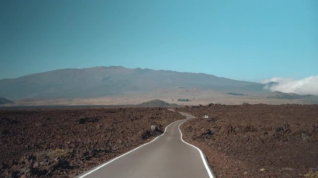 Tholeiitic basalt Lava flows (Kau Basalt) from Earth's largest active volcano Mauna Loa (Shield volcano). Pu'u Huluhulu, The Big Island (Hawaiʻi Island). Mauna Kea is in the distance.