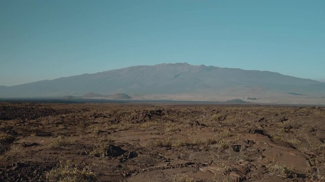 Tholeiitic basalt Lava flows (Kau Basalt) from Earth's largest active volcano Mauna Loa (Shield volcano). Pu'u Huluhulu, The Big Island (Hawaiʻi Island). Mauna Kea is in the distance.

