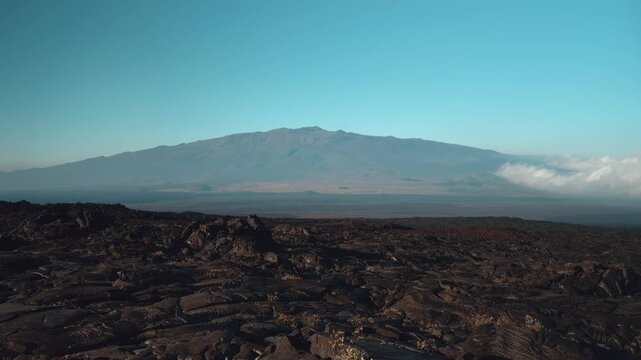 Tholeiitic basalt Lava flows (Kau Basalt) from Earth's largest active volcano Mauna Loa (Shield volcano). Pu'u Huluhulu, The Big Island (Hawaiʻi Island). Mauna Kea is in the distance.

