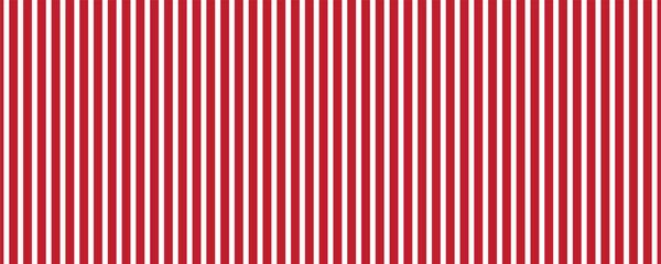 Obraz premium Vertical red and white stripes background. Seamless and repeating pattern.