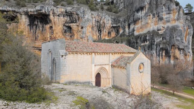 Romanesque hermitage of san bartolome standing against the backdrop of rio lobos canyon cliff