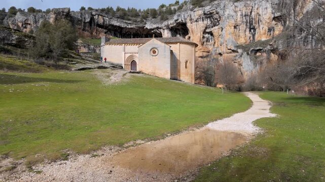 Romanesque hermitage of san bartolome standing against the backdrop of rio lobos canyon cliff