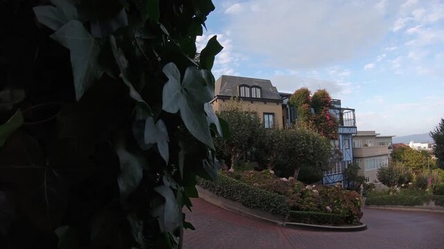 Lombard Street, one of the most famous landmark and the crookedest street in the world with vehicle car traffic and tourist people