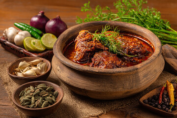 Delicious spicy lamb curry in traditional clay pot