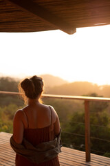 Fototapeta premium Woman Watching Sunset Over Valley