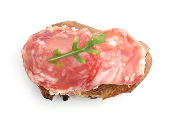 Delicious bruschetta with salami sausage, cream cheese and arugula isolated on white, top view